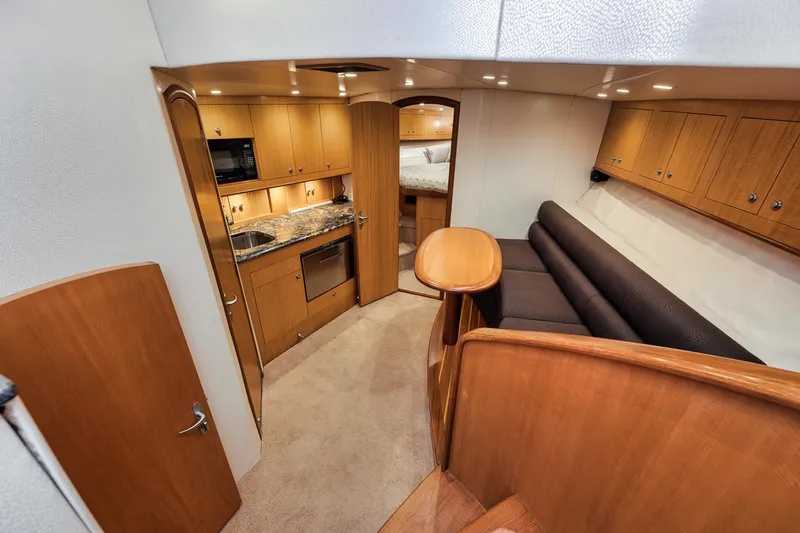 Slide: The Image of Luxurious interior of 2012 Spencer Yachts Express, featuring kitchen and seating area. - 29