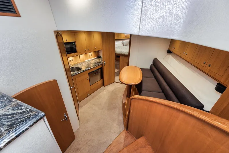 Slide: The Image of Luxurious cabin interior of 2012 Spencer Yachts Express with cozy bed and wooden cabinetry. - 30