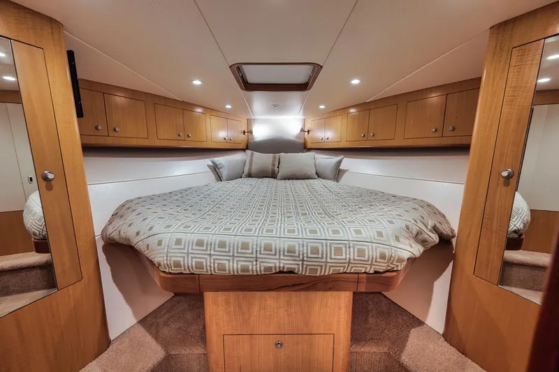 Slide: The Image of Luxurious 2012 Spencer Yachts Express interior with elegant wood finishes and modern amenities. - 32