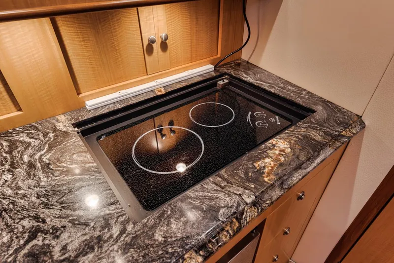 Slide: The Image of Luxury yacht kitchen with marble countertop and modern stovetop, Spencer Yachts Express 2012 model. - 35