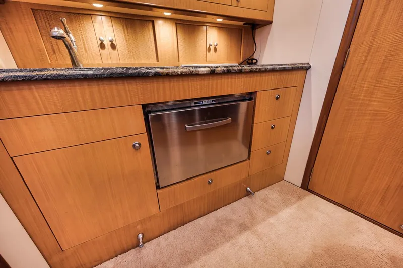 Slide: The Image of 2012 Spencer Yachts Express boat with wooden deck, ocean view. - 38