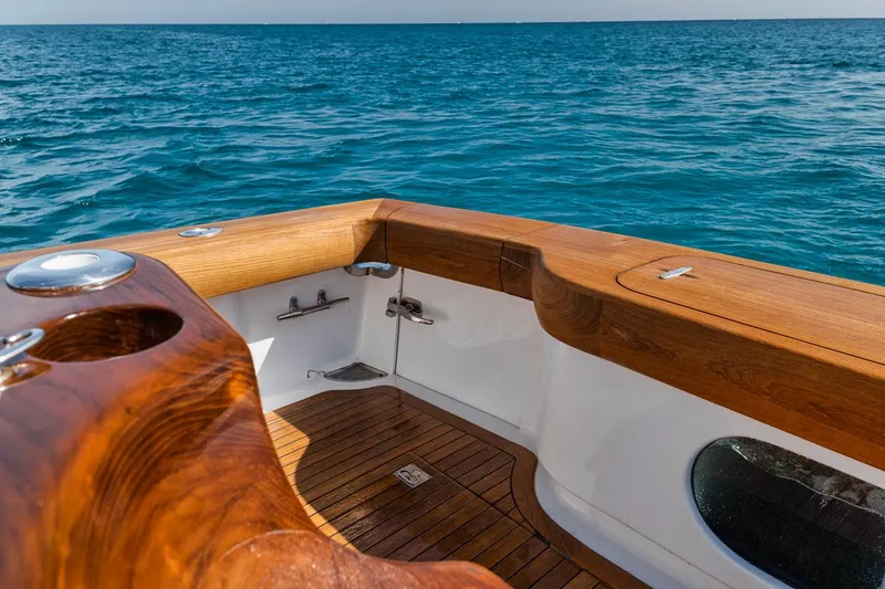 Slide: The Image of 2012 Spencer Yachts Express deck with wood finish and speaker. - 40