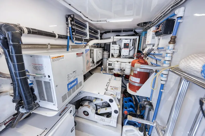 Slide: The Image of Engine room of 2012 Spencer Yachts Express, featuring equipment and machinery. - 16