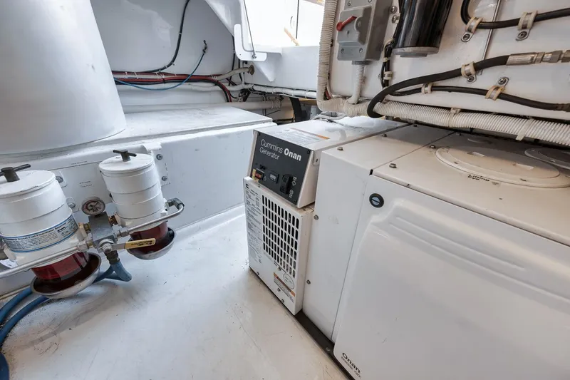 Slide: The Image of Engine room of 2012 Spencer Yachts Express with Cummins Onan generator. - 20