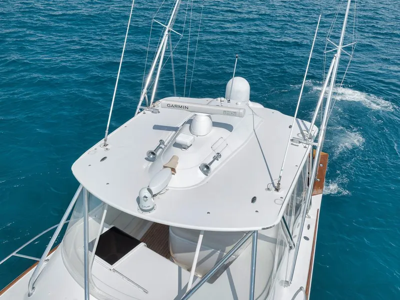 Slide: The Image of 2012 Spencer Yachts Express boat cruising on clear blue ocean waters. - 5