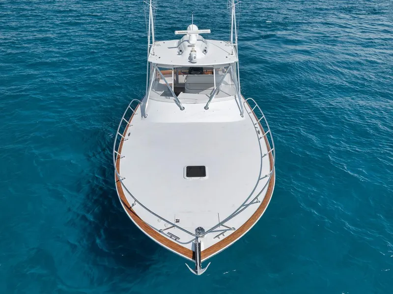 Slide: The Image of 2012 Spencer Yachts Express boat on clear blue water, aerial view. - 1
