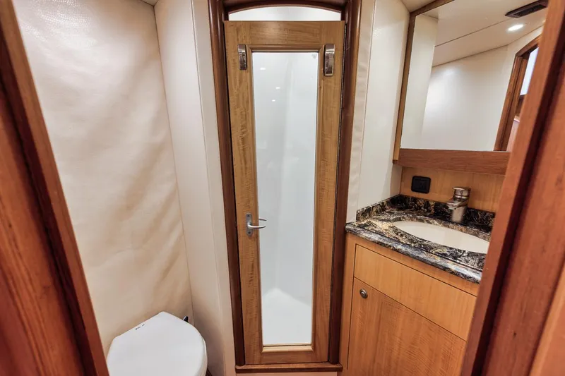 Slide: The Image of Luxurious 2012 Spencer Yachts Express bathroom with wood accents and modern fixtures. - 27