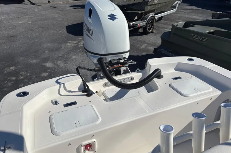 Slide: The Image of 2026 Sundance B20CCR boat with Suzuki outboard motor, featuring a spacious deck layout. - 13