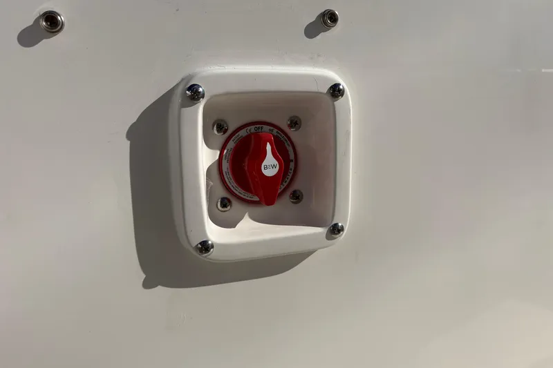 Slide: The Image of Red switch on Sundance B20CCR 2026 model, mounted on a white surface. - 16