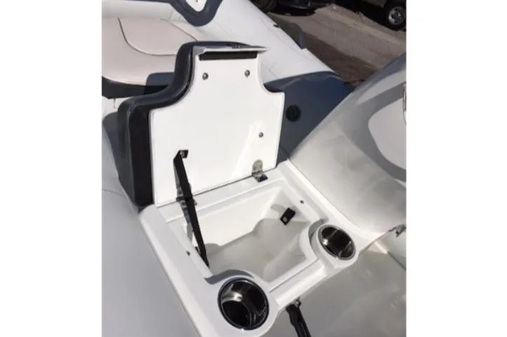 Slide: The Image of 2025 Walker Bay Generation 11 LTE boat interior with storage compartment and cup holders. - 8