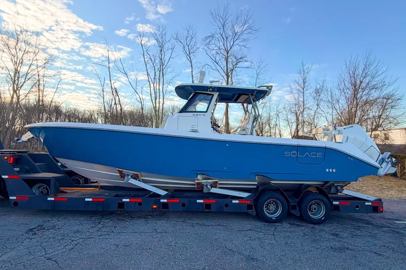 The Image of Solace 32 CS 2026 boat on trailer at sunset. - 0