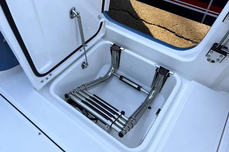 Slide: The Image of Solace 32 CS 2026 boat ladder in storage compartment. - 23
