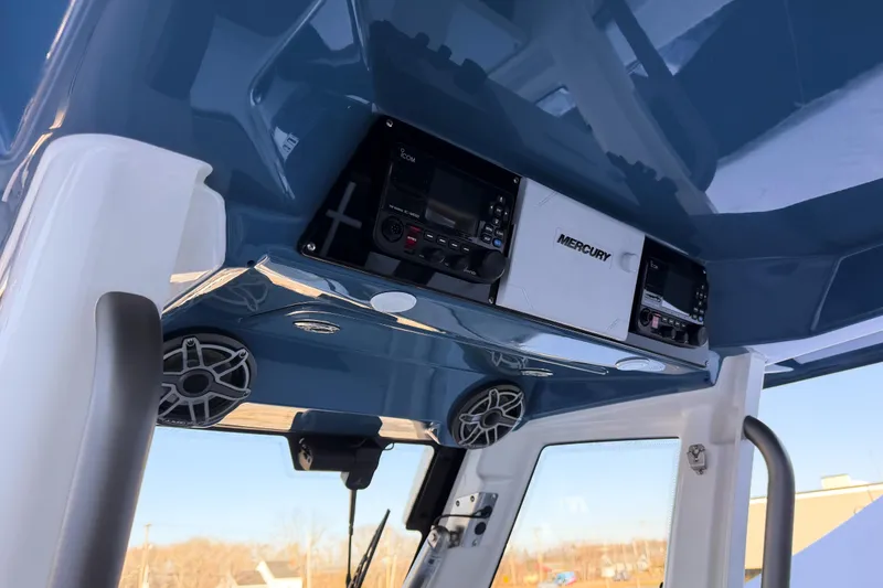 Slide: The Image of Interior view of 2026 Solace 32 CS boat helm. - 37