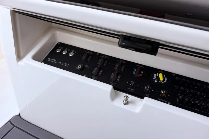 Slide: The Image of Solace 32 CS 2026 control panel with switches and dials. - 44