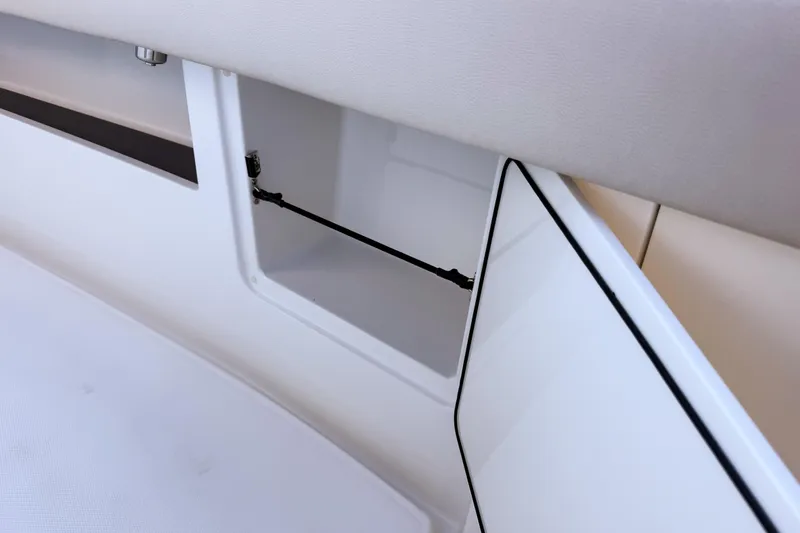Slide: The Image of Open storage compartment in Solace 32 CS boat, year 2026. - 48