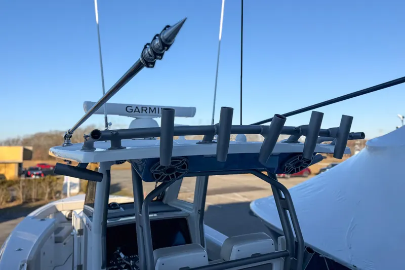 Slide: The Image of Solace 32 CS 2026 boat with Garmin equipment and fishing rod holder. - 70