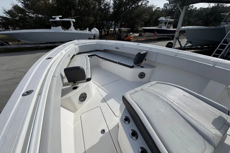 Slide: The Image of 2023 Fountain 38 Tournament Edition boat interior with seating and speakers. - 13