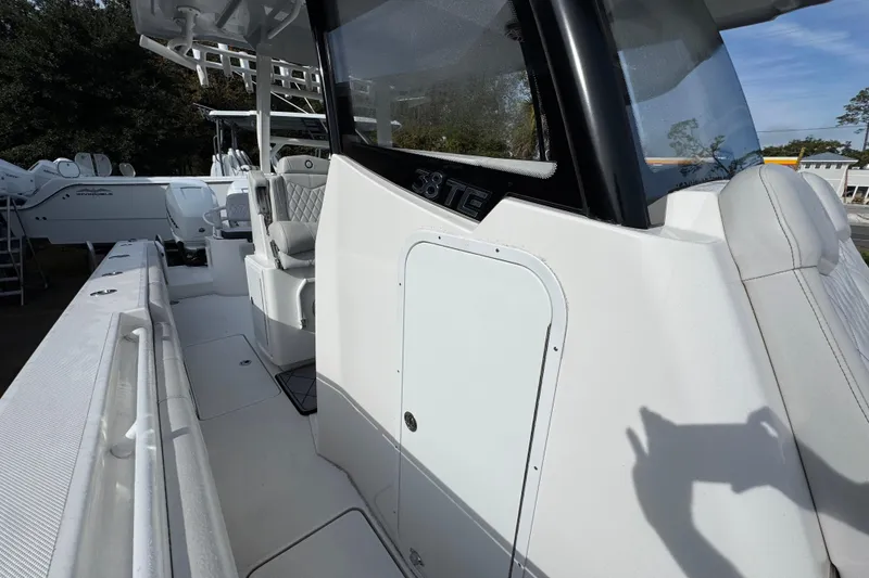 Slide: The Image of 2023 Fountain 38 Tournament Edition boat, white interior, sleek design, outdoor setting. - 17