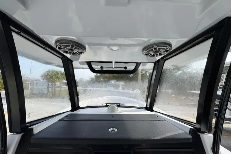 Slide: The Image of 2023 Fountain 38 Tournament Edition boat interior with speakers and windshield view. - 23