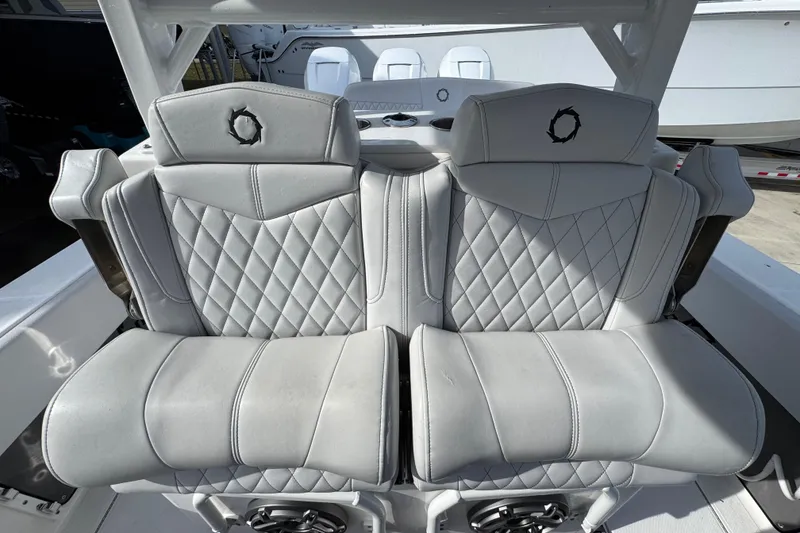Slide: The Image of 2023 Fountain 38 Tournament Edition boat seats with diamond stitching and logo detail. - 26