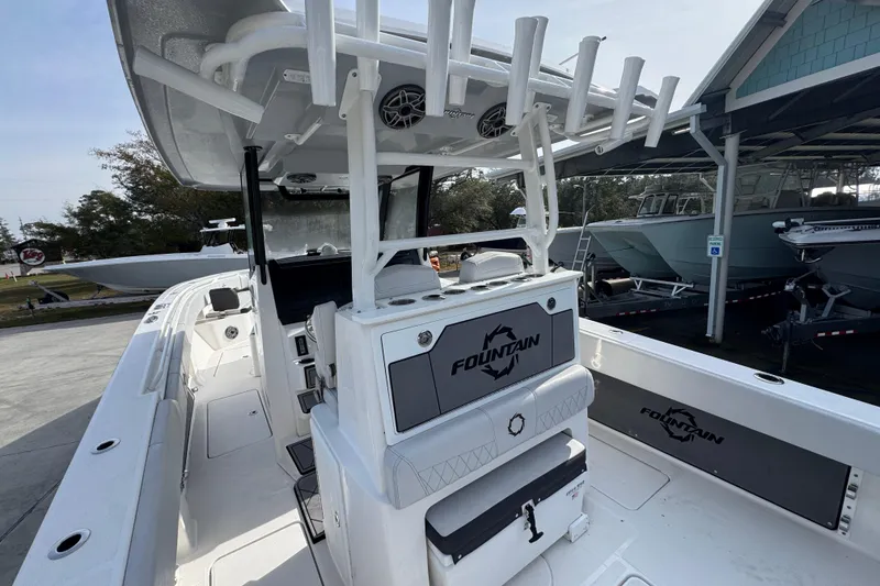 Slide: The Image of 2023 Fountain 38 Tournament Edition boat interior with rod holders and seating. - 29