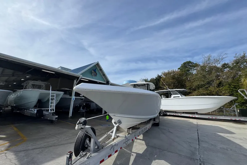 Slide: The Image of 2023 Fountain 38 Tournament Edition boat on trailer at marina. - 5