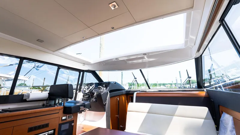 Slide: The Image of Interior of 2018 Jeanneau NC11 yacht with modern design and panoramic windows. - 16