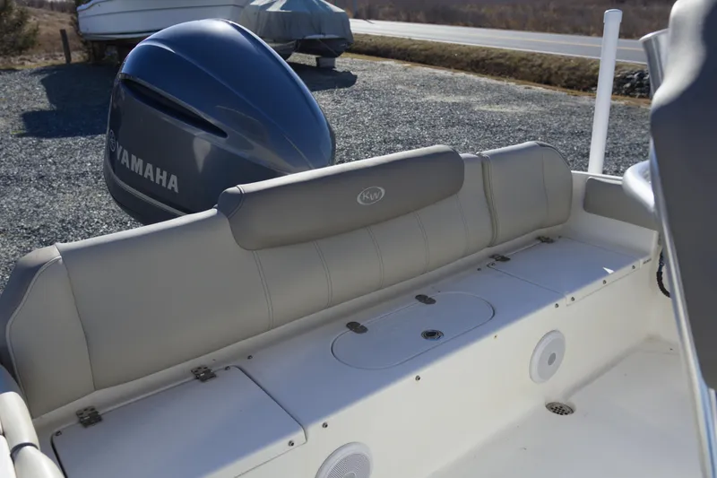 Slide: The Image of 2022 Key West 219 FS boat with Yamaha engine, featuring comfortable seating and storage. - 6