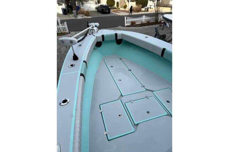 Slide: The Image of 2019 Latitude Tournament Boats 25, spacious deck, sleek design, mint green accents. - 5