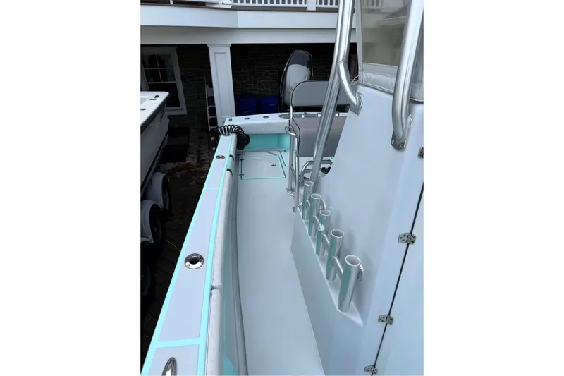 Slide: The Image of 2019 Latitude Tournament Boats 25 interior with rod holders and seating. - 9