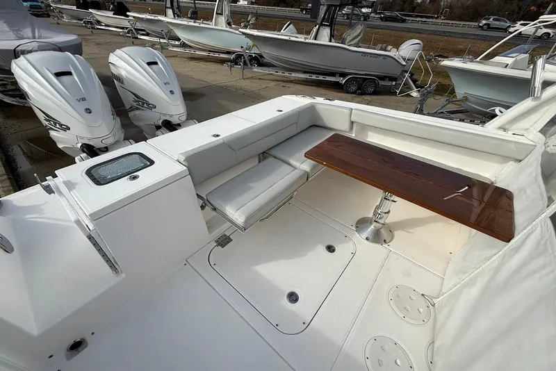 Slide: The Image of 2020 Everglades 340 Dual Console boat with seating and twin outboard engines. - 13