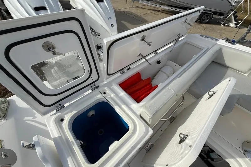 Slide: The Image of 2020 Everglades 340 Dual Console boat storage compartments and seating area. - 16