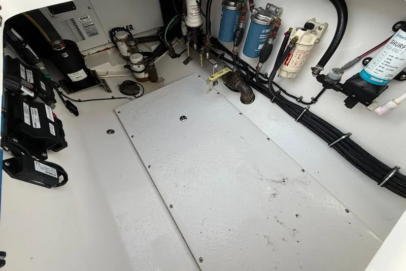 Slide: The Image of Engine compartment of a 2020 Everglades 340 Dual Console boat, showcasing wiring and components. - 17