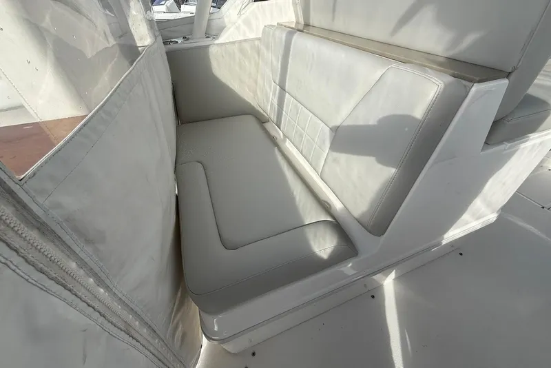 Slide: The Image of White seating area on a 2020 Everglades 340 Dual Console boat. - 22