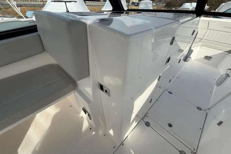 Slide: The Image of 2020 Everglades 340 Dual Console interior with seating and storage compartments. - 29