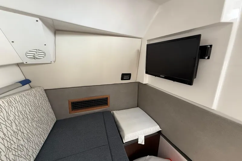 Slide: The Image of Interior cabin of 2020 Everglades 340 Dual Console with TV and seating area. - 31