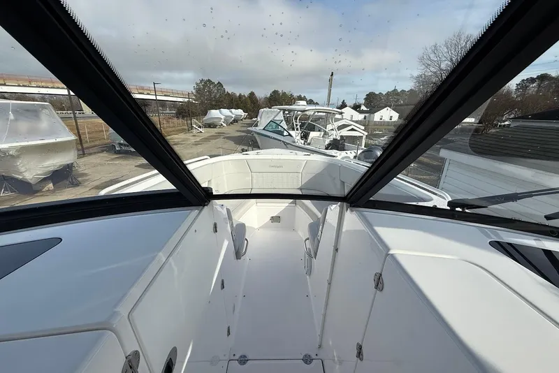 Slide: The Image of 2020 Everglades 340 Dual Console boat interior with clear windshield view. - 39
