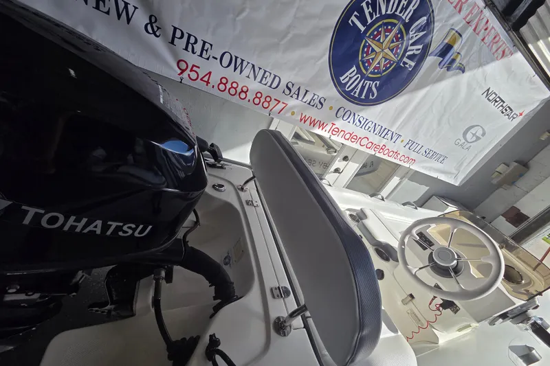 Slide: The Image of 2018 Walker Bay Supertender 365 with Tohatsu engine at Tender Care Boats showroom. - 9