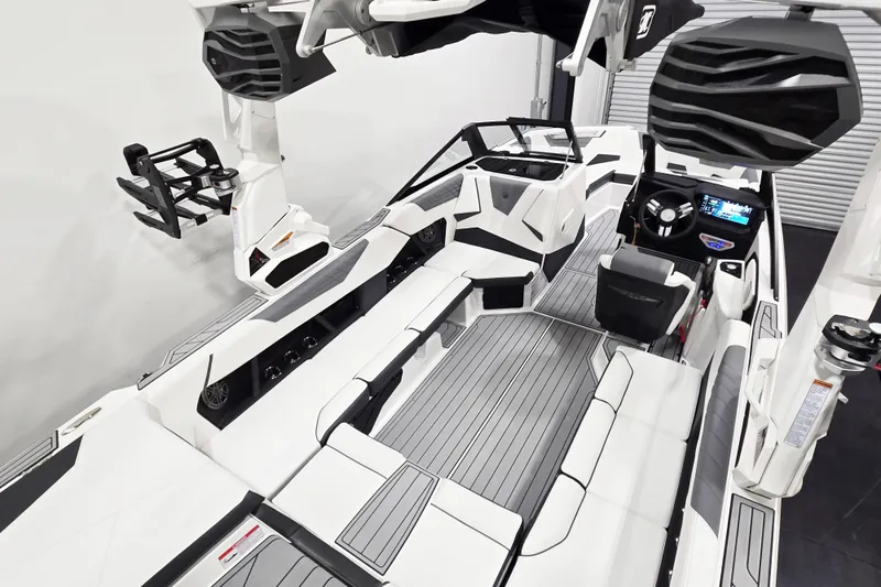 Slide: The Image of 2026 Nautique Super Air Nautique S23 interior with sleek seating and advanced dashboard. - 10