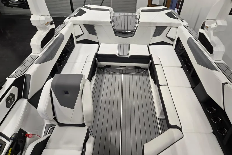 Slide: The Image of 2026 Nautique Super Air Nautique S23 interior with sleek, modern seating and stylish design. - 8