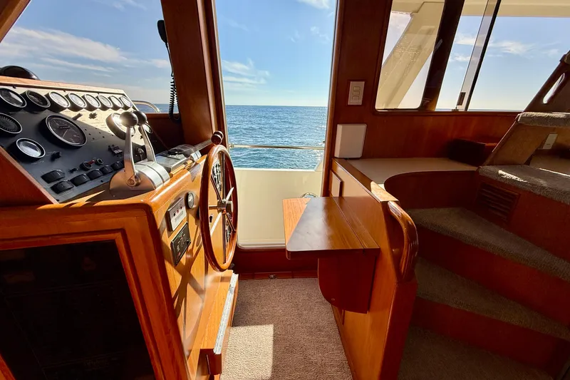 Slide: The Image of Interior helm of 1997 Offshore Yachts 48 Sedan with ocean view. - 35