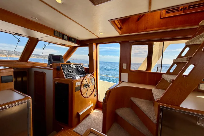 Slide: The Image of Interior of 1997 Offshore Yachts 48 Sedan with ocean view through windows. - 40