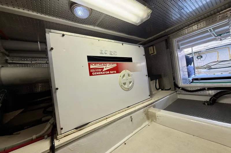 Slide: The Image of Engine room of 1997 Offshore Yachts 48 Sedan with Northern Lights generator. - 85