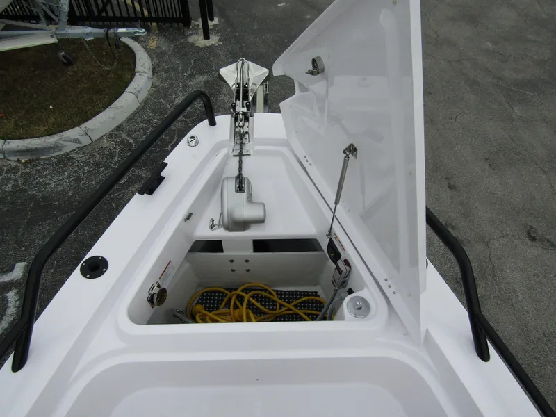 Slide: The Image of 2024 Axopar 37 Sun Top anchor storage compartment with open hatch. - 17