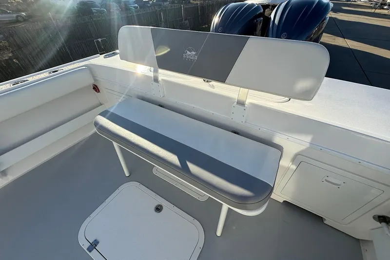 Slide: The Image of 2023 Steiger Craft 31 Chesapeake boat seating area with dual outboard motors. - 12