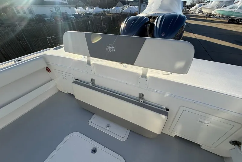Slide: The Image of 2023 Steiger Craft 31 Chesapeake boat interior with seating and dual engines. - 13