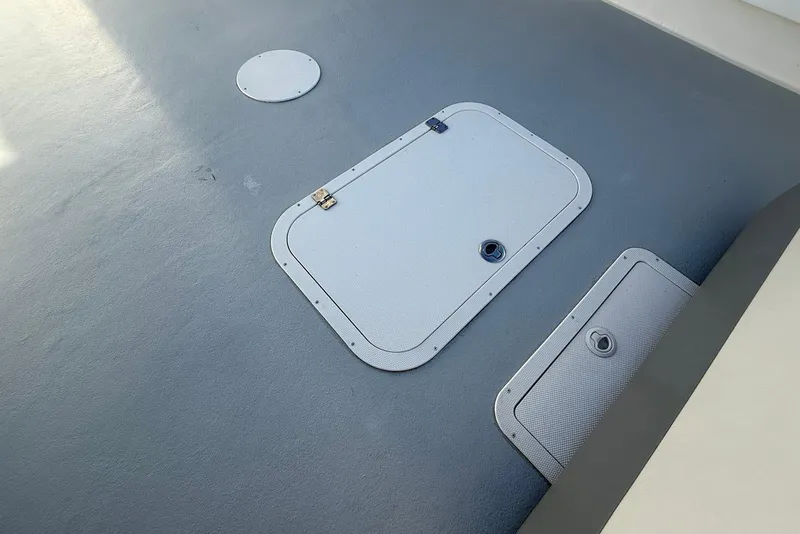 Slide: The Image of Deck hatches on 2023 Steiger Craft 31 Chesapeake boat, featuring secure latches. - 14