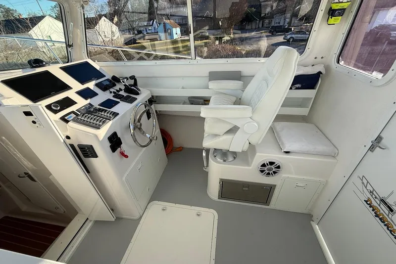Slide: The Image of Interior of 2023 Steiger Craft 31 Chesapeake boat with helm, controls, and seating. - 22