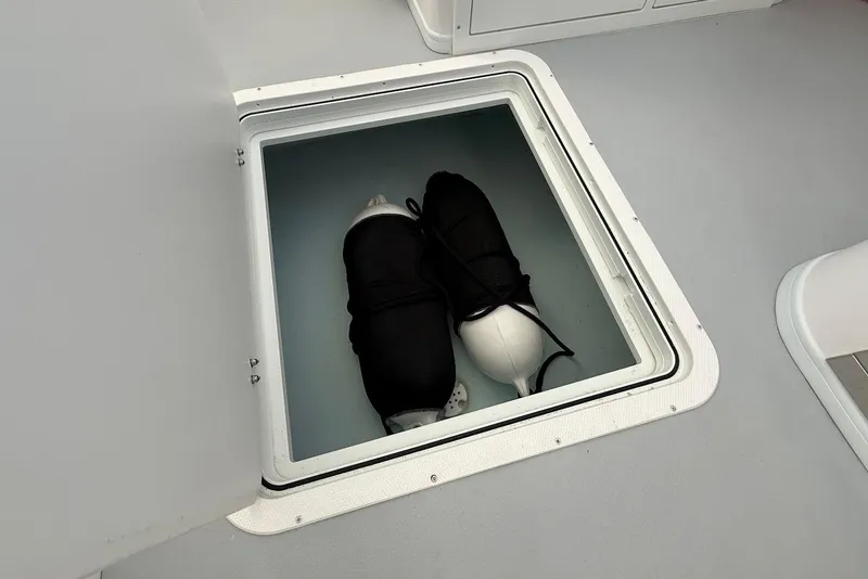 Slide: The Image of Storage compartment on 2023 Steiger Craft 31 Chesapeake boat with fenders inside. - 24