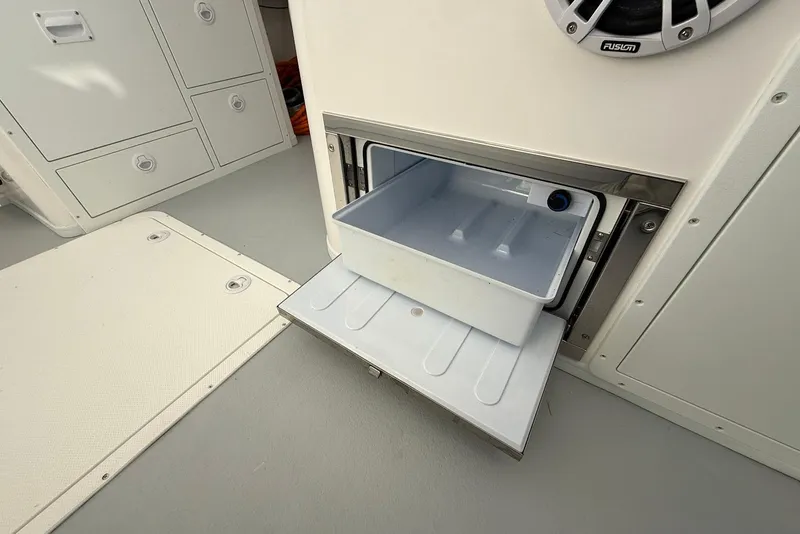 Slide: The Image of 2023 Steiger Craft 31 Chesapeake boat interior with open storage compartment. - 25